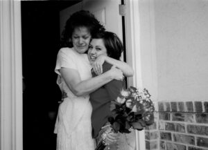 Mom and Holly hugging on a surprise visit.