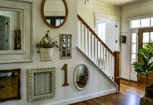 Gallery wall with vintage gold mirrors and frames.