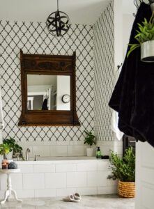 vintage mirror hung above the white tub.